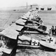 German Albatros D.IIIs of Jagdstaffel 11 and Jagdstaffel 4 parked in a line at La Brayelle near Douai, France. Richthofen’s aircraft is the second aircraft in line, painted red. (Imperial War Museum)